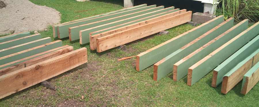 Painting the sleepers for the wicking bed